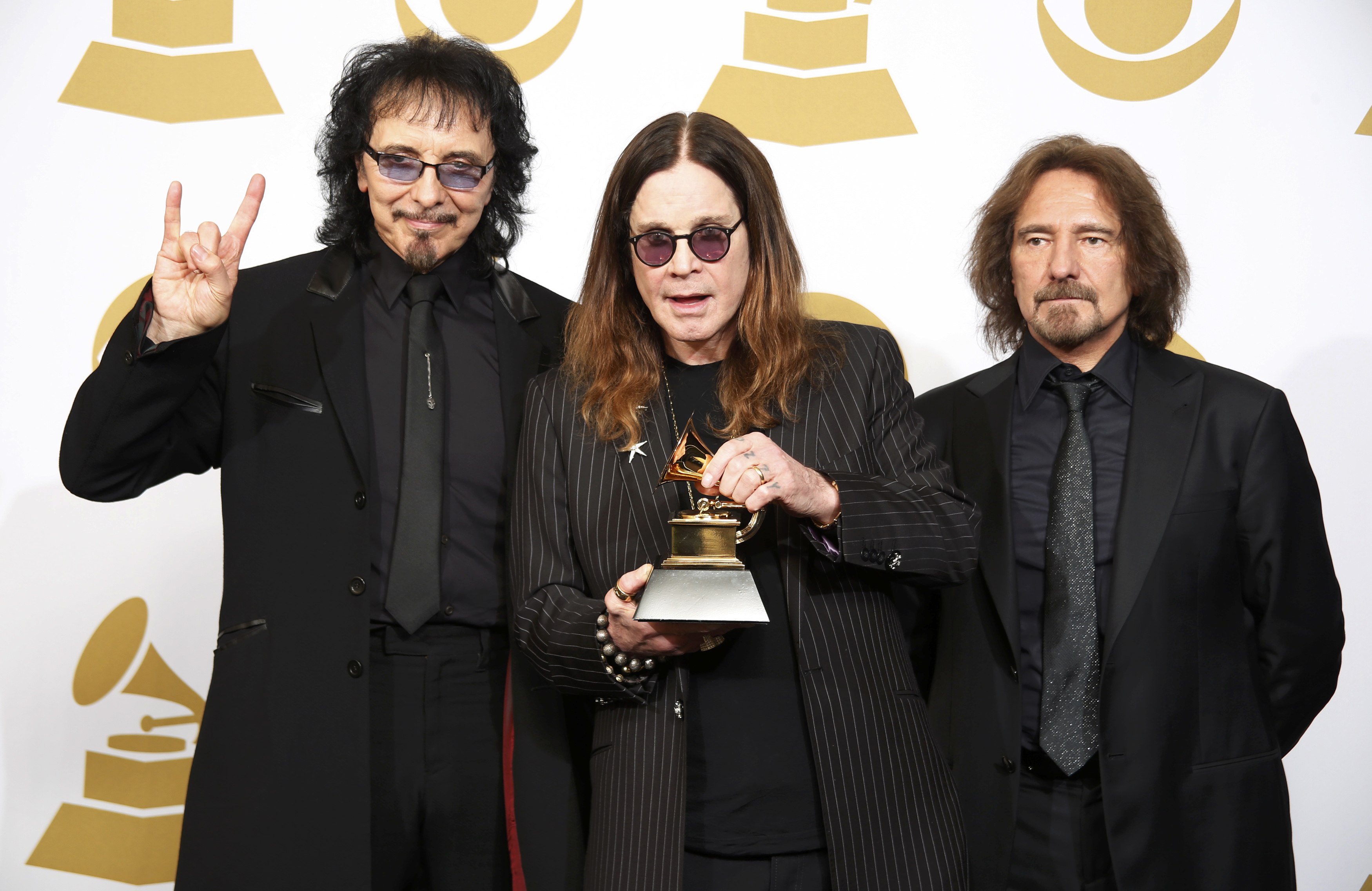 Musicians Tony Iommi, Ozzy Osbourne and Geezer Butler of Black Sabbath pose with their award for Best Metal Performance for "God is Dead?" at the 56th annual Grammy Awards in Los Angeles