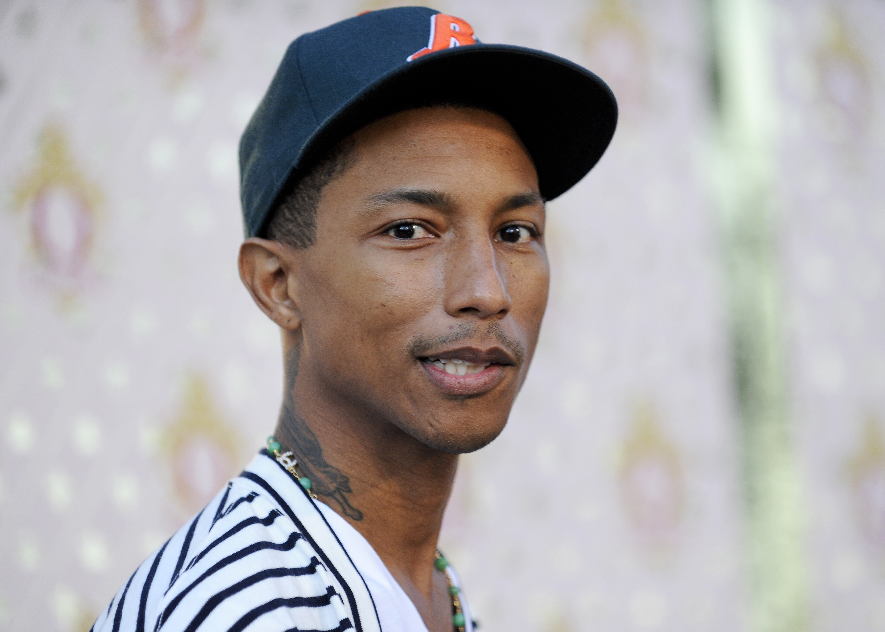 Designer, actor, producer Pharrell Williams arrives at his launch for his new liqueur in the Beverly Hills area of Los Angeles