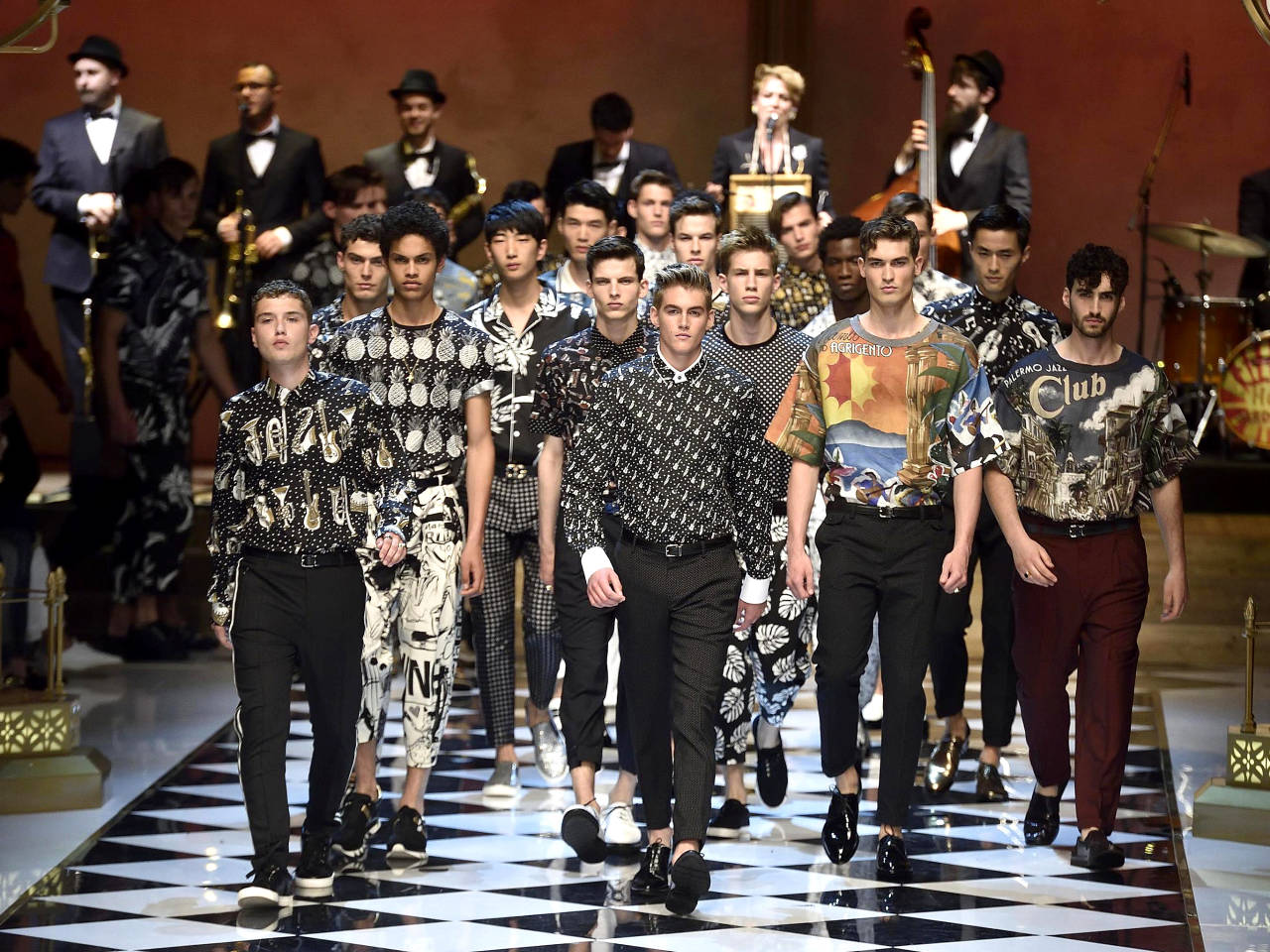 Models wear creations for Dolce&Gabbana men's Spring Summer collection part of the Milan Fashion Week, unveiled in Milan, Italy, Saturday, June 18, 2016 (Flavio Lo Scalzo/Ansa via AP)