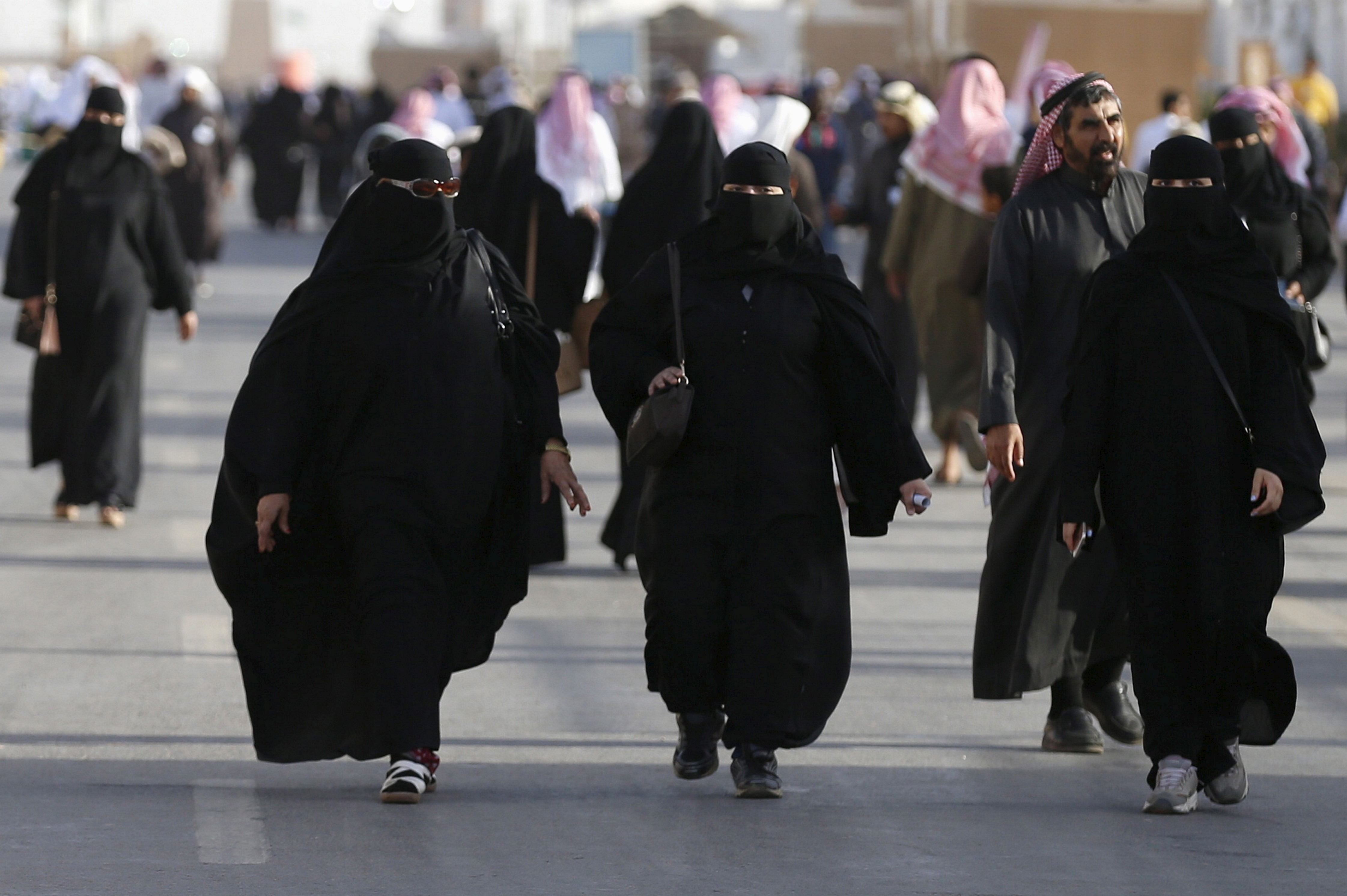 Saudi women arrive to attend Janadriyah Culture Festival on the outskirts o...